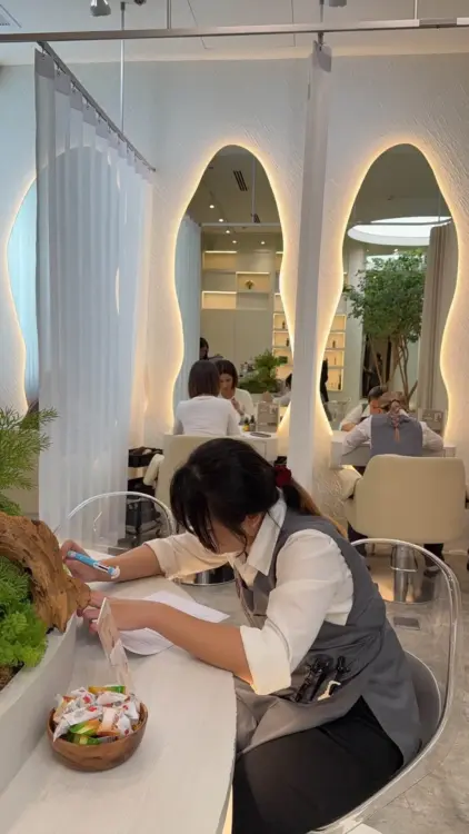Siesta Head Spa therapists completing a knowledge assessment to maintain professional service standards