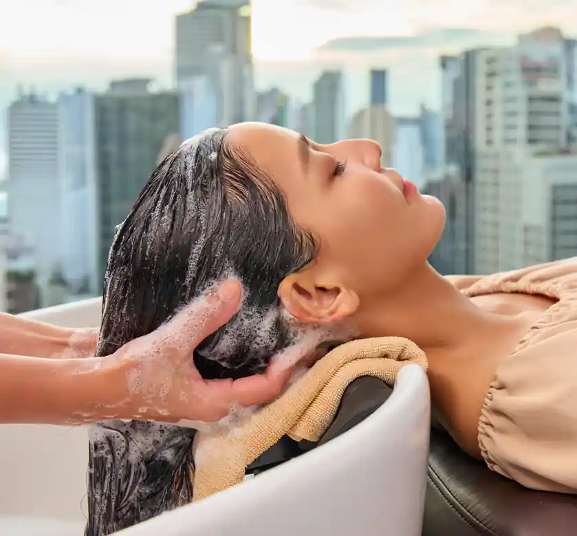 Deep cleansing hair and scalp wash with essential oil shampoo and relaxing head massage during the Siesta Relaxing program.