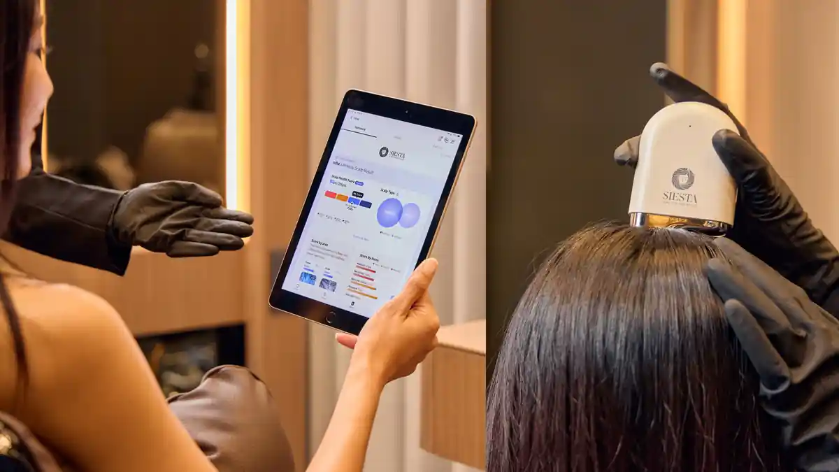 Expert examining hair and scalp using Advanced AI Scalp Analysis with detailed results displayed on screen during the Oway Scalp Solution program.